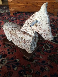 Old wooden horse that little Emma likes to "milk".