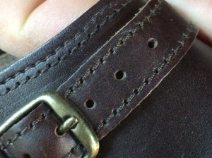 Double stitch on edge, single stitch on buckle strap